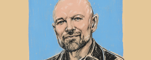 Ilustracja. Uśmiechnięty mężczyzna (Piotr Oczko) na niebiesko-beżowym tle. Jest ubrany w czarną koszulę. Ma lekki zarost.